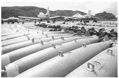 Converted T-28 trainer aircraft and 250-pound bombs used by Meo pilots of Vang Pao&#x0027;s &#x0022;mini-Air Force,&#x0022; a CIA-sponsored unit that fought against the North Vietnamese in northern Laos in 1972. &#x00A9;BETTMANN/CORBIS.